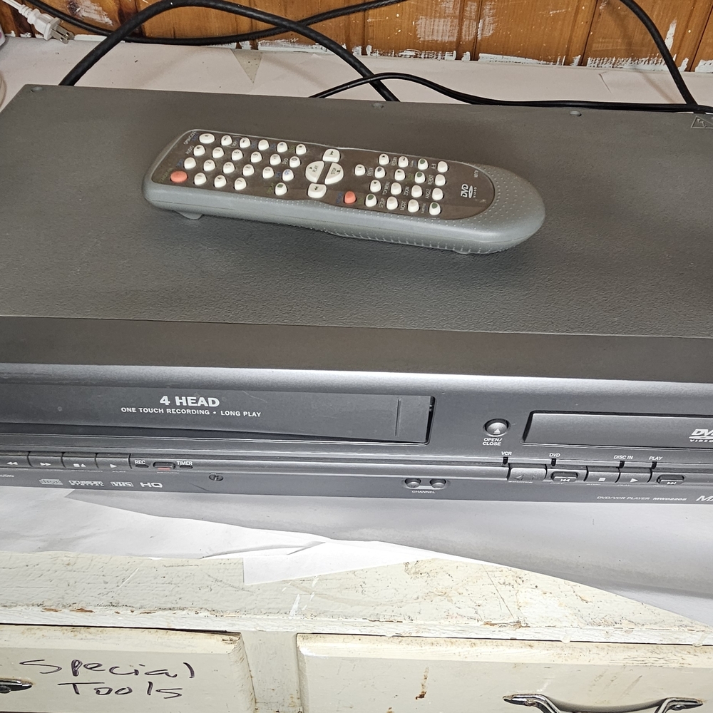 Silver Magnavox DVD VCR Combo with Remote. Untested. Selling For Parts.